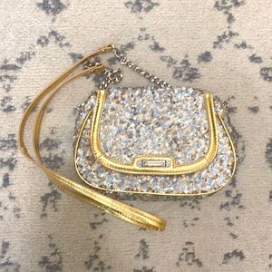 Gold and silver sequin crossbody bag by Nine West with chain detailing on strap.